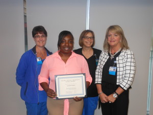 Pictured (from left): Janet Williams, Frank Spoone Memorial Respiratory Therapy scholarship committee member; Senchia Wilson, scholarship recipient; Martha Huddelson, committee member; Sherri Gordon, director of respiratory therapy services at Self Regional Healthcare.