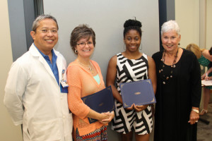 Members of the Charlotte Blackwell Memorial Nursing Scholarship committee present certificates to 2014 scholarship recipients, Kadeidra Chandler of Edgefield and Mona McKinney of Greenwood. Pictured from left are John Paguntalan, Mona McKinney, Kadeidra Chandler and Kaye Brock. (Not pictured is scholarship winner Ashley Edwards of Saluda.)