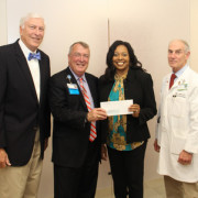 United Center for Community Care: (From Left): Self Regional Board of Trustees Chairman Len Bornemann is joined by Self Regional CEO Jim Pfeiffer, Deborah Parks, Executive Director of the United Center for Community Care, and Cardiologist Dr. Ennis James, who serves on the Community Outreach Committee.