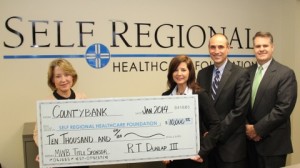 The Self Regional Healthcare Foundation's 2014 Mid-Winter Ball co-chair, Jane Dean (left), recently accepted a $10,000 check from Countybank representatives, Lynn Turner and David Tompkins and Greenwood Capital and Associate's John Wiseman.