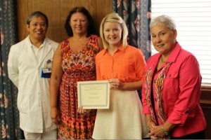 Members of the Charlotte Blackwell Memorial Nursing Scholarship committee present a certificate to 2013 scholarship recipient, April Payton. Pictured from left are John Paguntalan, Jackie Thornton, Ms. Payton and Kaye Brock. Not present is scholarship recipient Brandon Scott.