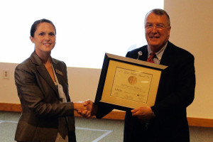 Self Regional Healthcare CEO Jim Pfeiffer accepts the Gold Medal Award on behalf of the organization, from Emily O'Sullivan of the South Carolina Hospital Association (SCHA).