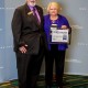 Infection Prevention Coordinator Nancy Lumley from Self Regional Healthcare is presented a Zero Harm Award from the South Carolina Hospital Association's Dr. Rick Foster at a recent meeting in Columbia.