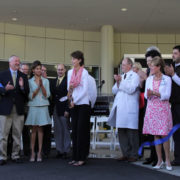 Former patient Lynn Johnson cuts the ribbon for the new consolidated Self Regional Healthcare Cancer Center.