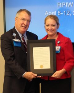 Palmetto Gold winner Sharon Walb is presented a special recognition certificate from Self Regional Healthcare President Jim Pfeiffer. 