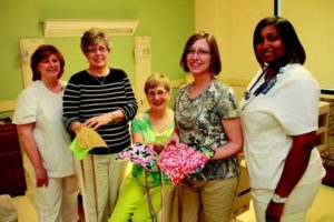 Self Regional Nurse manager Louise Cox thanks Sewing Guild members Linda Goldstein, Sue McFarland and Evie Galloway, with surgical nurse Derquis Mitchell. 