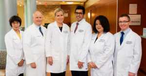Photo showing the six health providers of Self Regional Healthcare Cancer Center in Greenwood SC: Ruiling Yuan MD, John Funke III MD, Joanna M. Sadurski MD, Ahmad Rahal MD, Cathy Pasco MD, and E. Clint Wood MD.