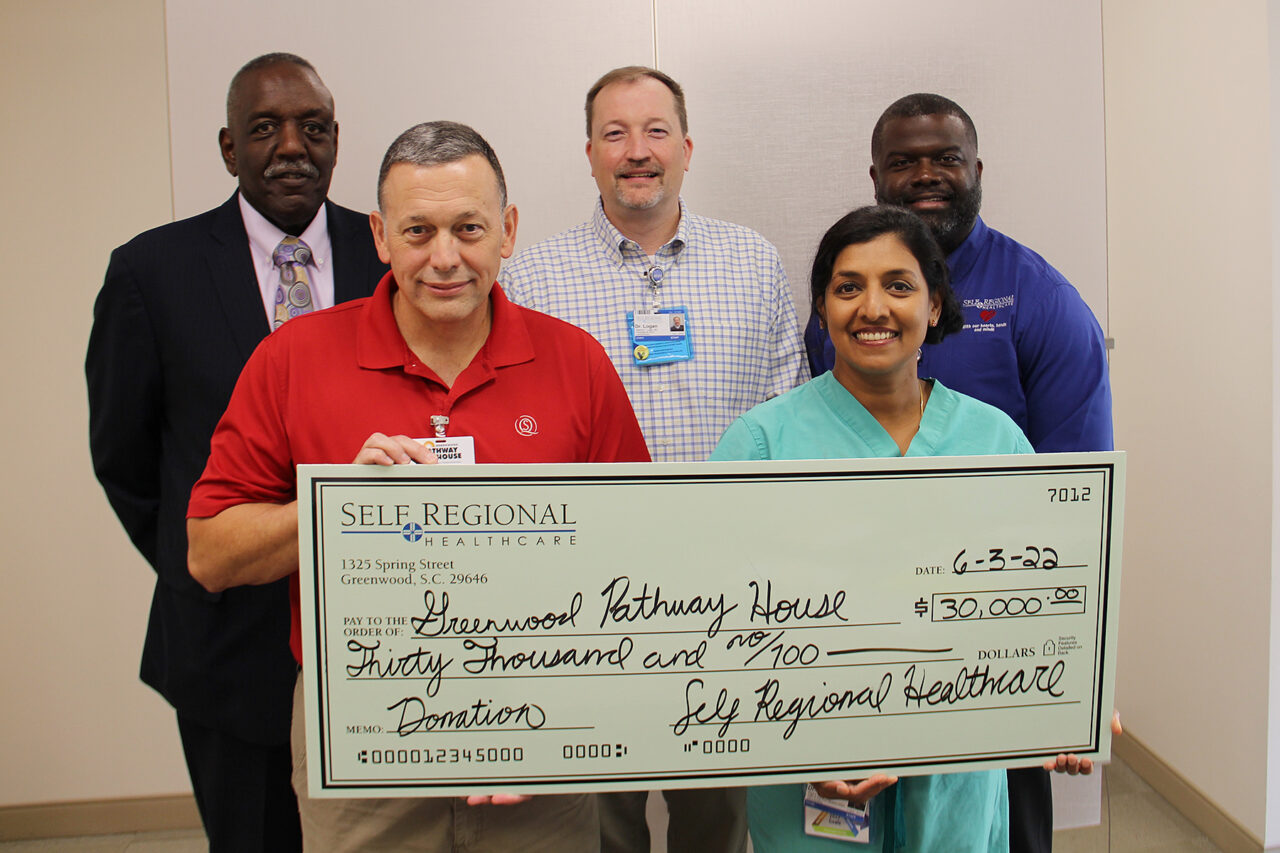 Self Regional Healthcare staff present $30,000 donation check to Greenwood Pathway House