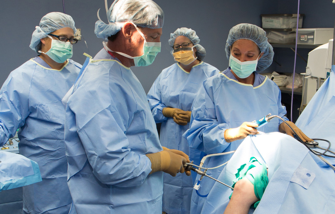 Masked doctors in operating room