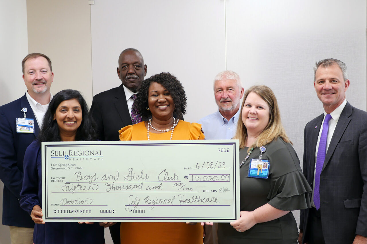 Self Regional Healthcare staff present $15,000 donation check to Boys and Girls Club