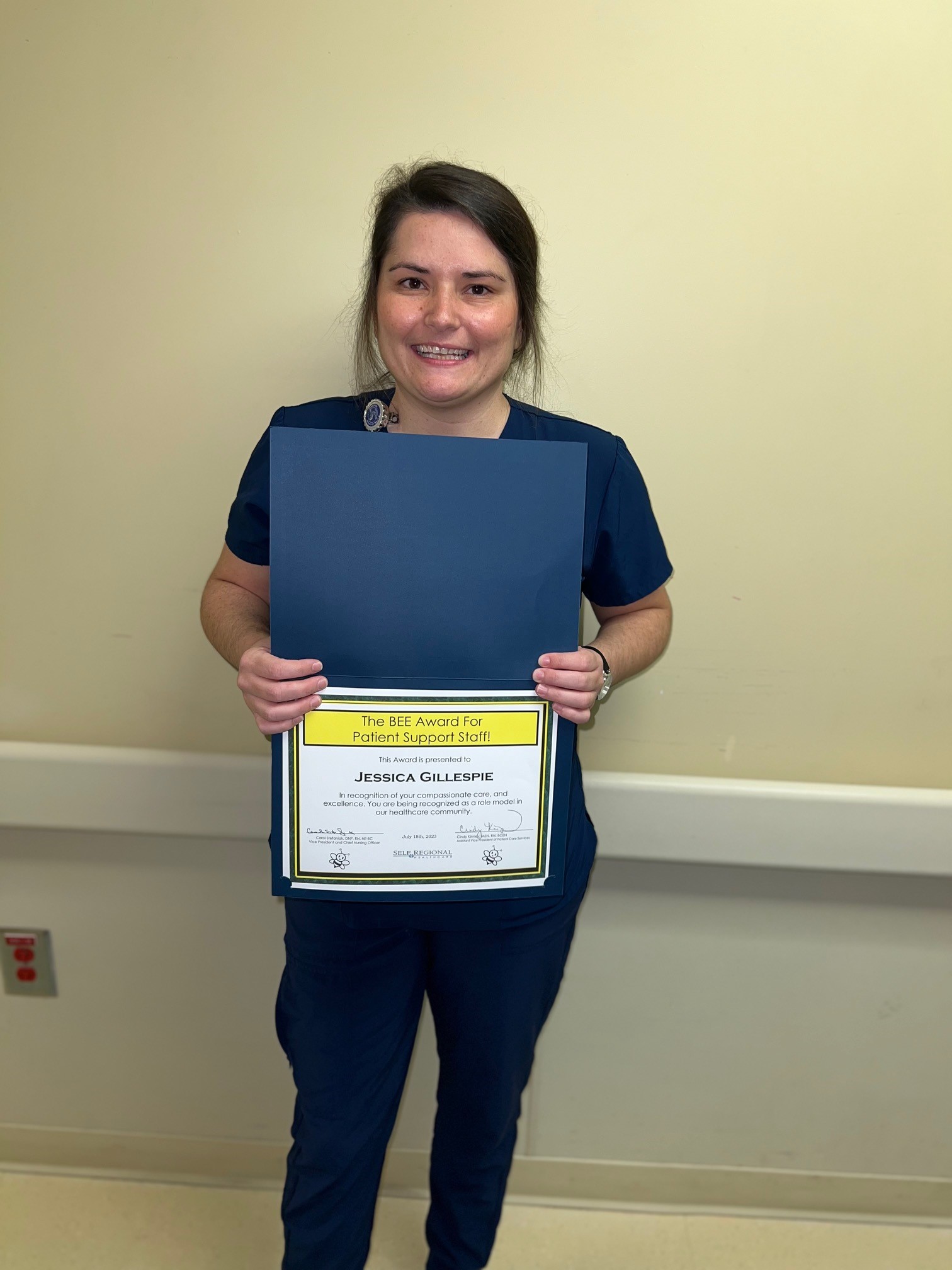 Jessica Gillespie with The BEE Award For Patient Support Staff certificate