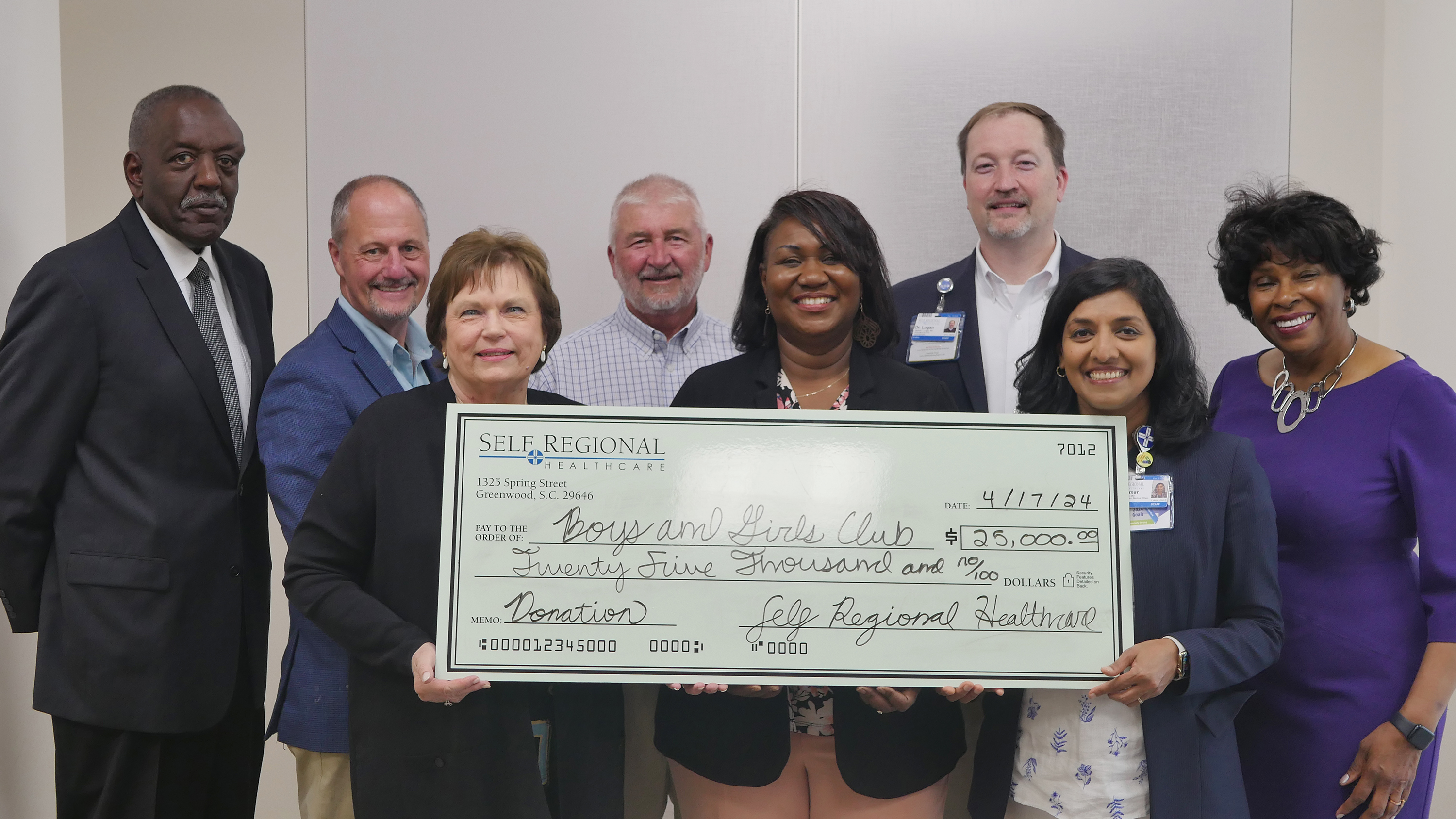 Self Regional Healthcare staff present donation check to Boys and Girls Club
