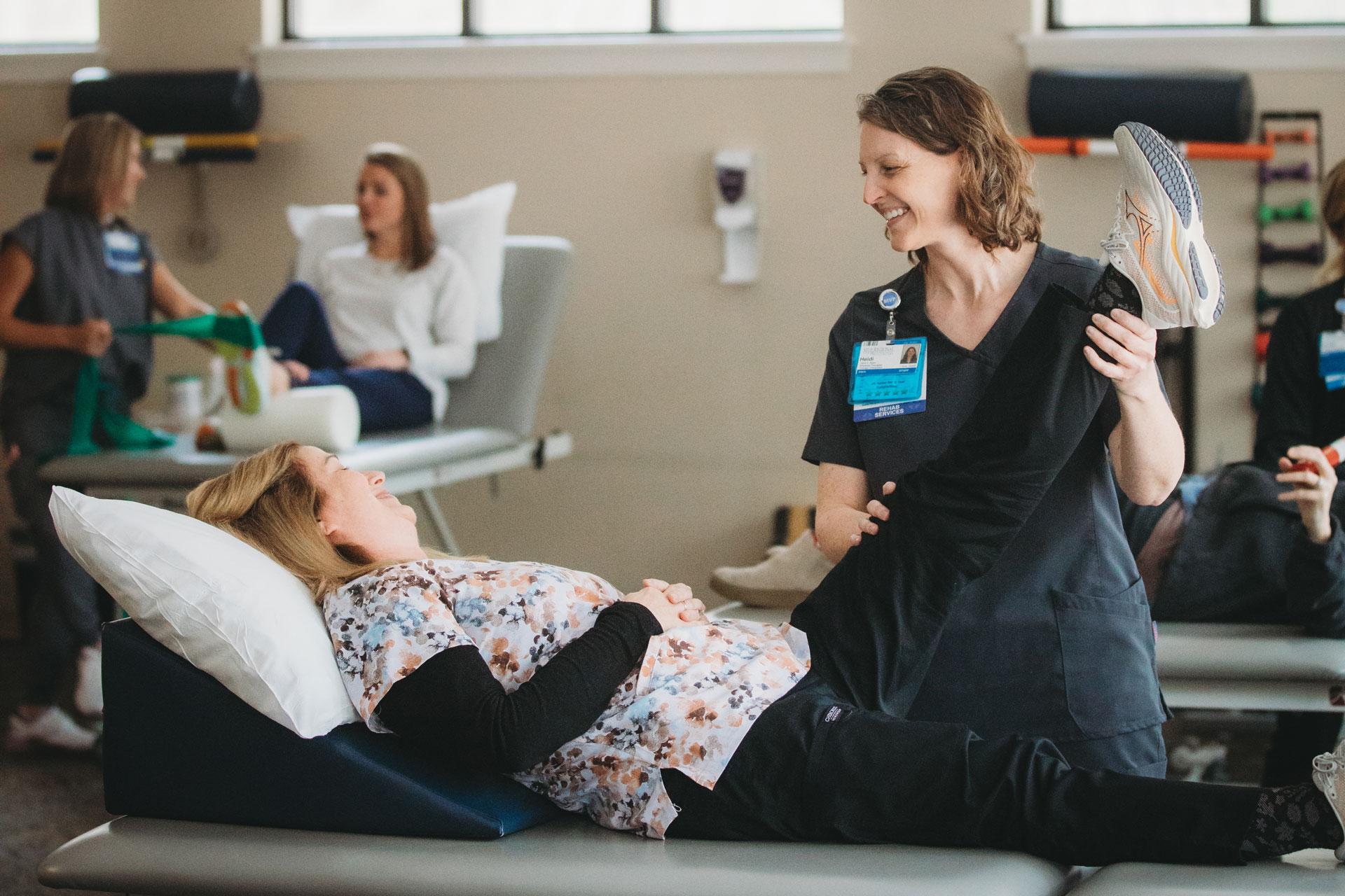 Healthcare provider demonstrating patient care techniques to students