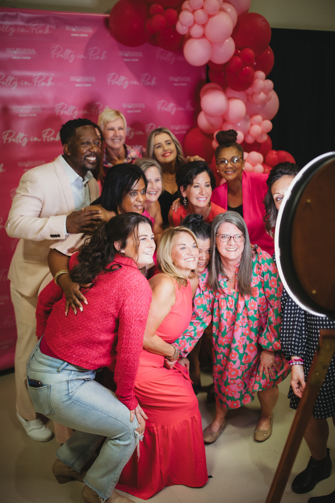 Healthcare professionals at pink-themed event