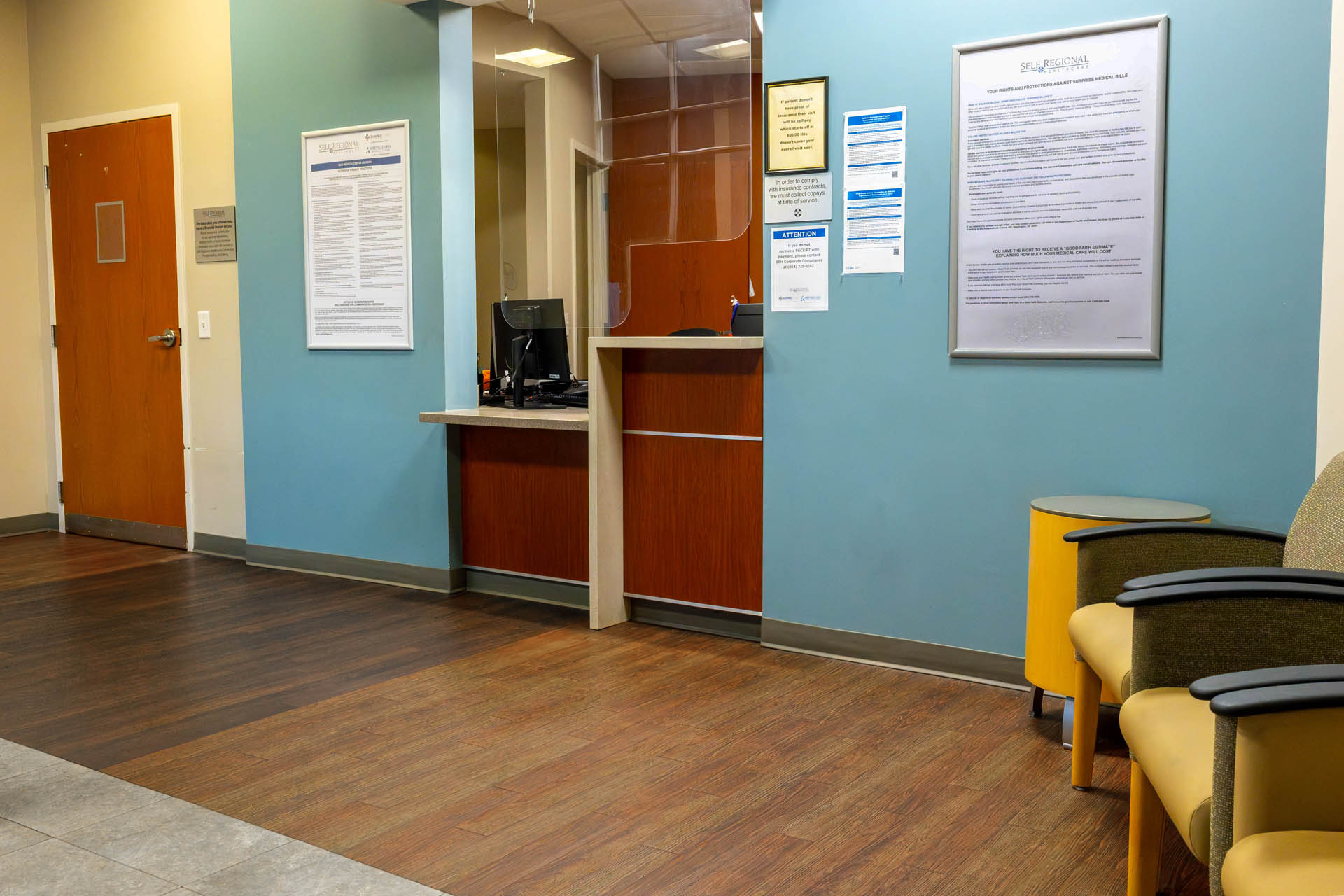 Self Regional Healthcare reception area with check-in desk and waiting seating