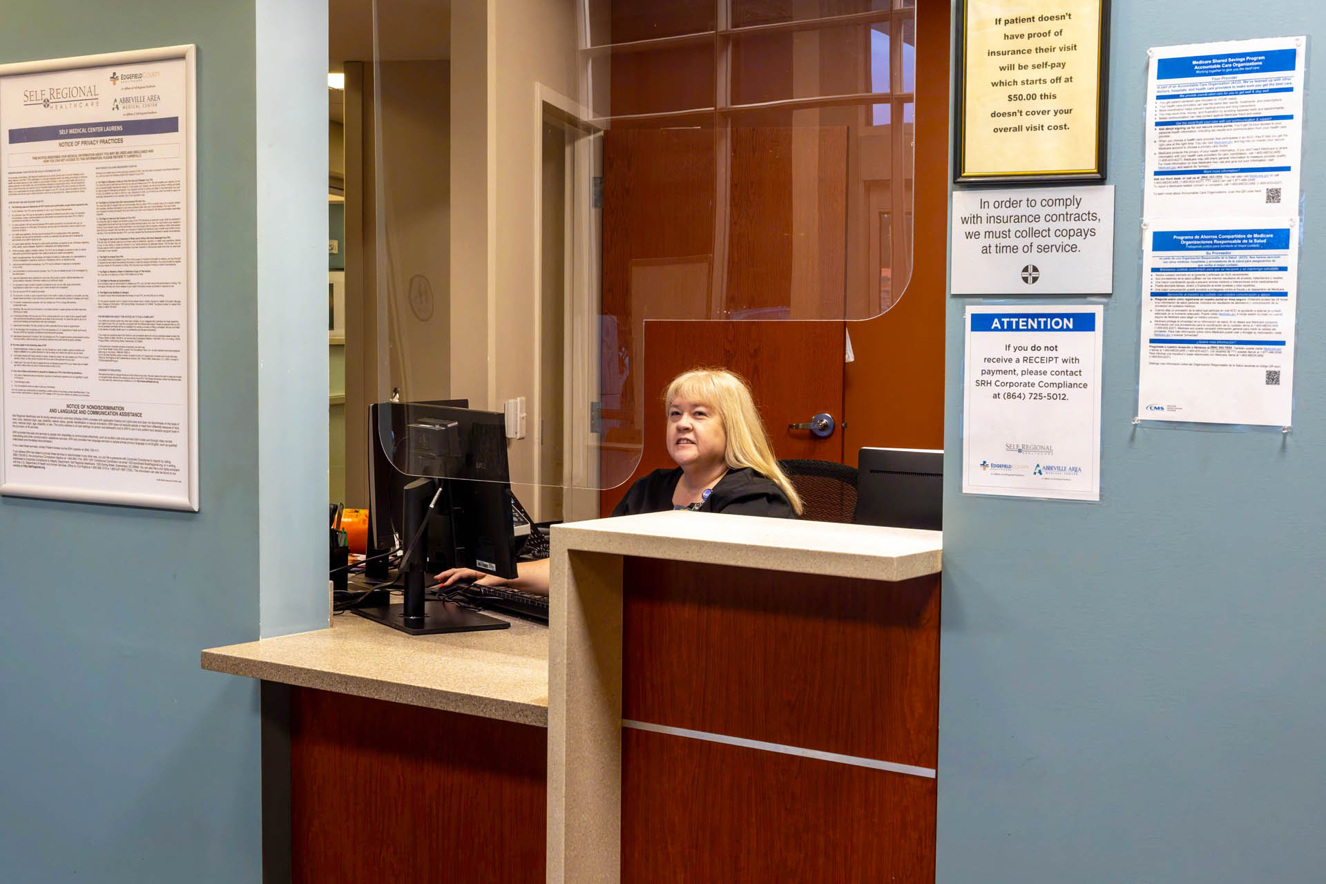 Healthcare receptionist at front desk