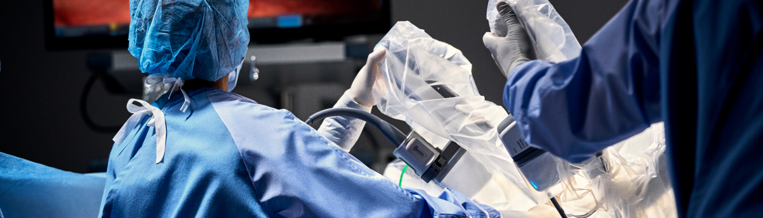 Surgical team performing minimally invasive procedure in operating room