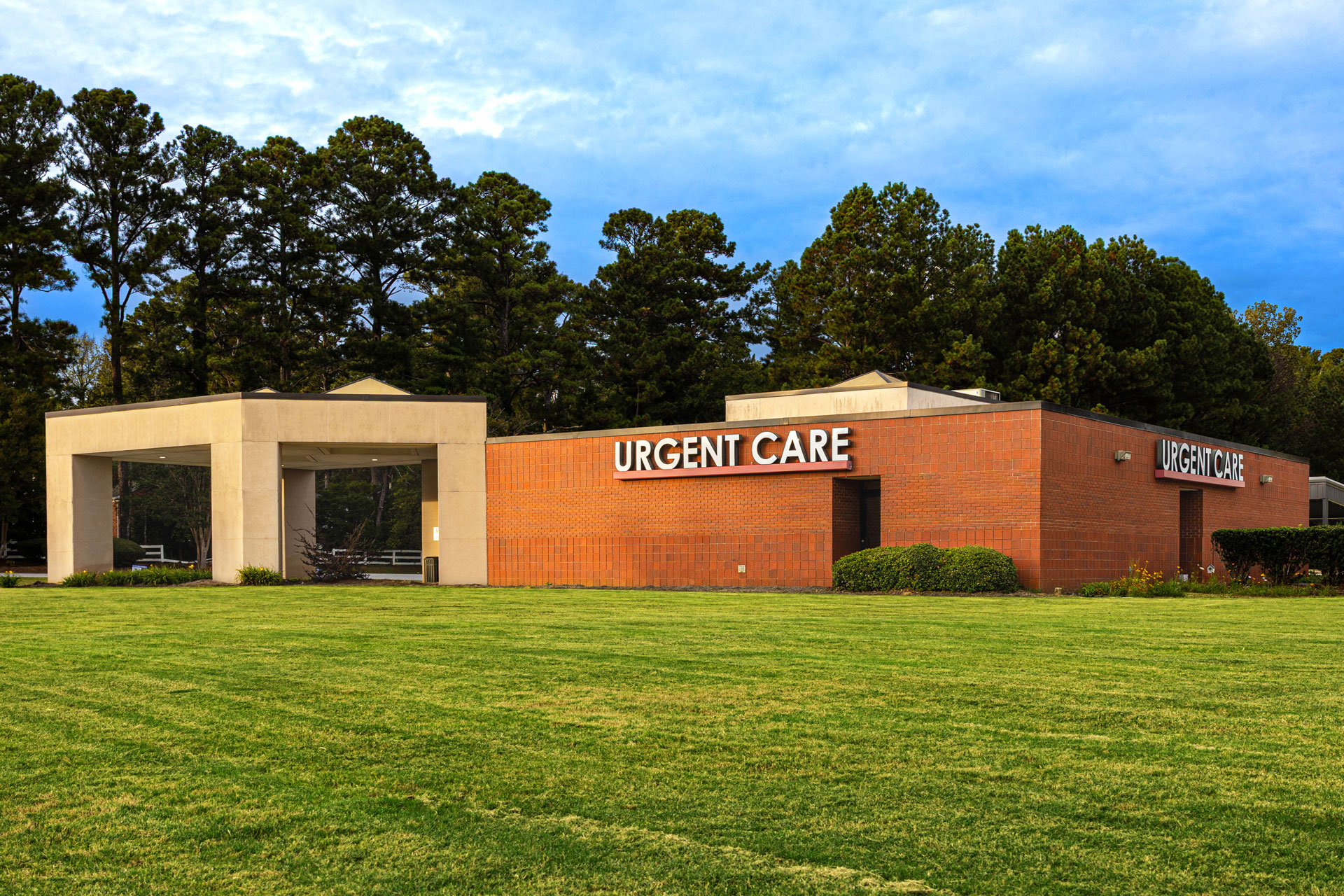 Self Regional Healthcare urgent care facility exterior with brick building and entrance.