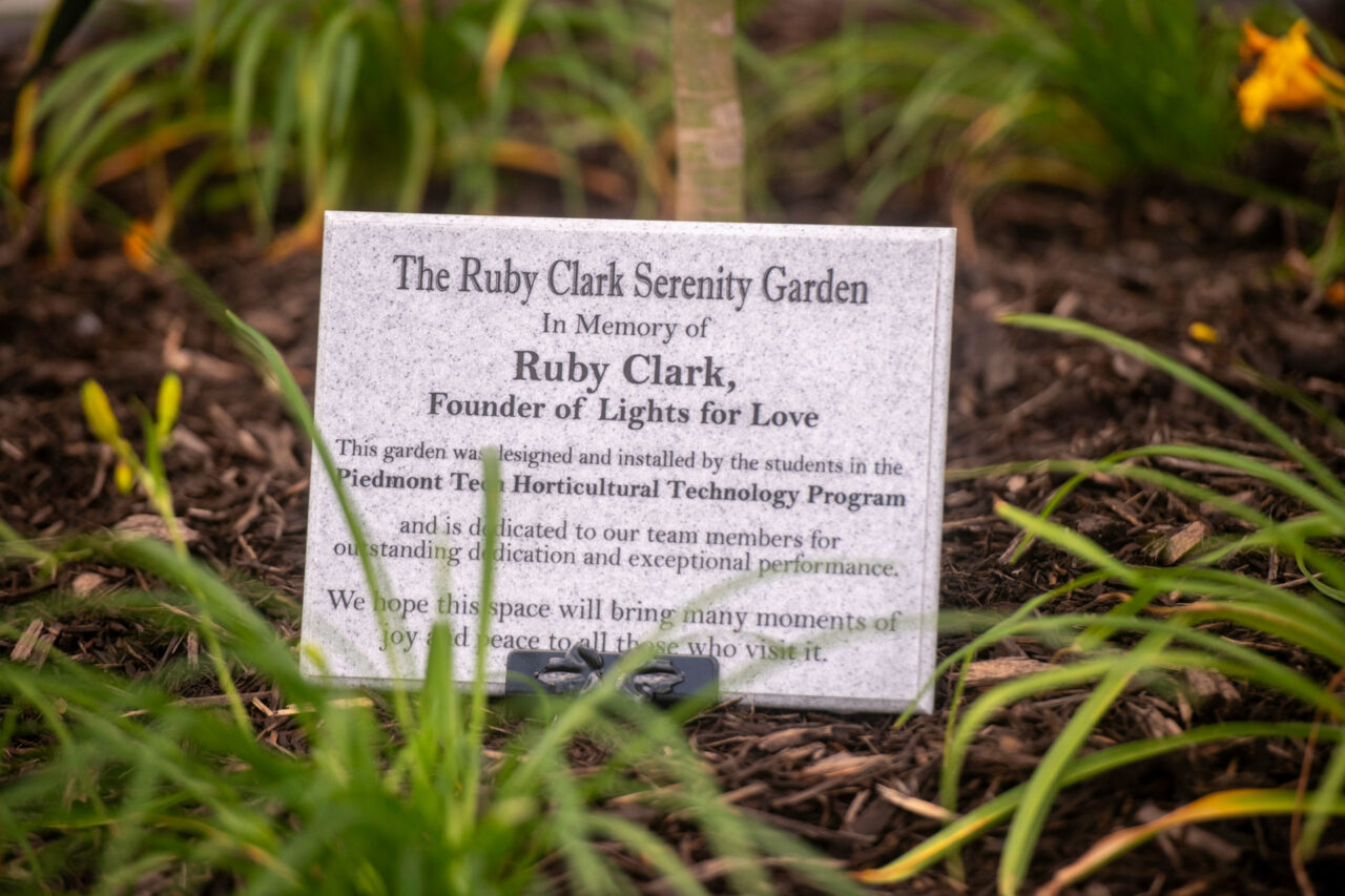 Ruby Clark Serenity Garden memorial plaque with plantings