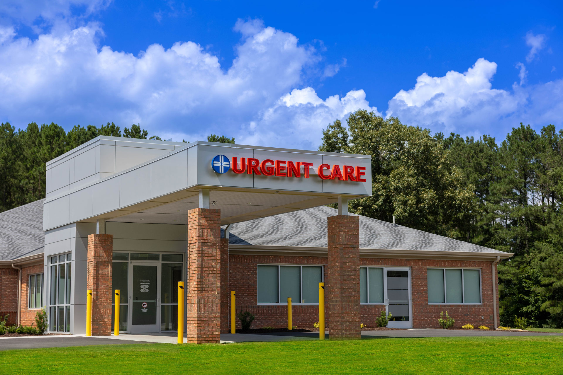 Front entrance of Self Regional Urgent Care Saluda with URGENT CARE canopy signage and covered patient drop-off