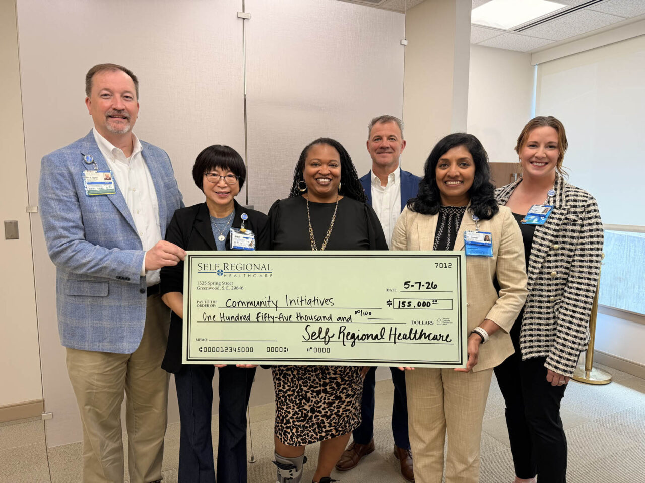 Self Regional Healthcare leaders present a check for 155,000 dollars to Community Initiatives