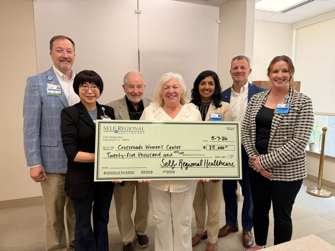 Self Regional Healthcare leaders present a check for 25,000 dollars to CrossRoads Women’s Center