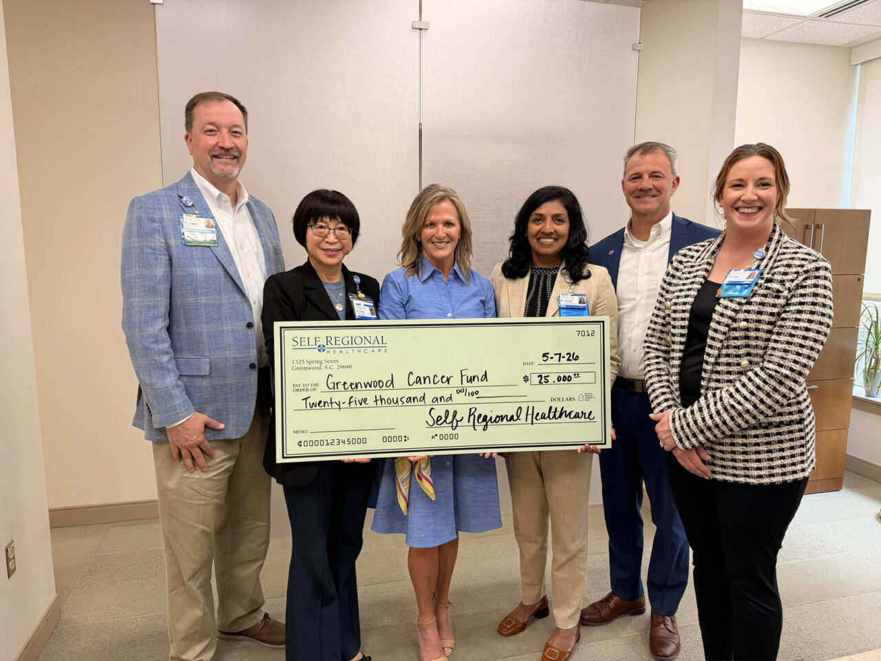 Self Regional Healthcare leaders present a check for 25,000 dollars to Greenwood Cancer Fund