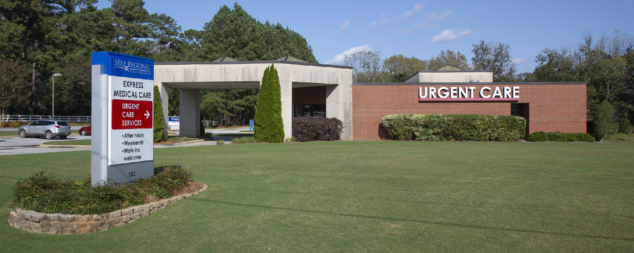 Self Regional Express Medical Care urgent care facility exterior with signage and parking lot